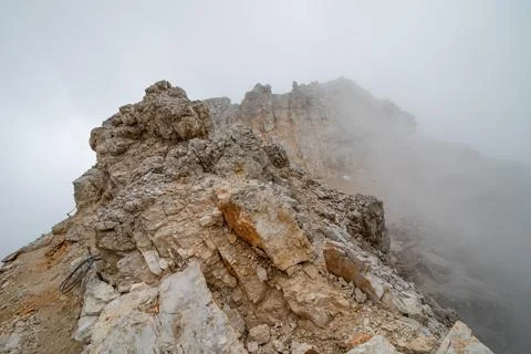 View obscured by clouds from the top of Cima di Mezzo (3154 m). Stock Photos