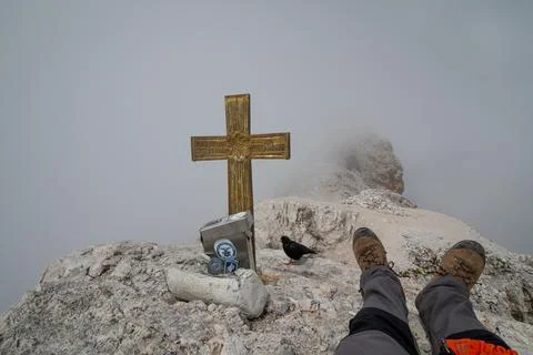 View obscured by clouds from the top of Cima di Mezzo (3154 m). The tourist.. Stock Photos