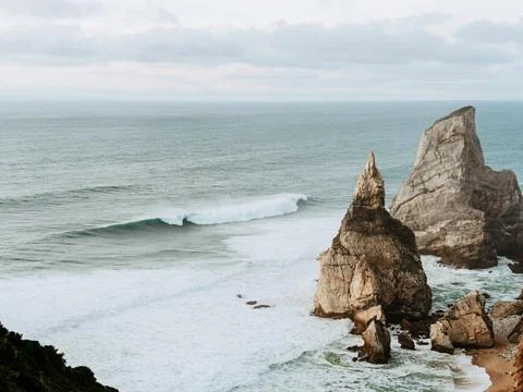 View from the observation deck of impressive sea cliffs rising from the ocean Stock Photos