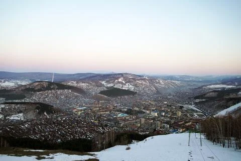 View from the observation deck of a small town among the mountains Stock Photos