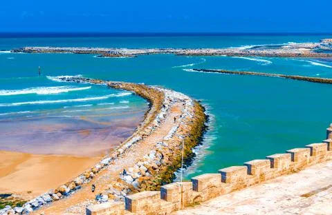 View of the ocean and the breakwaters that separate the mouth of the Bou Regr Stock Photos