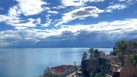 View of the ocean. The blue sky and the sun's rays breaking through the clouds. Stock Footage 238033666