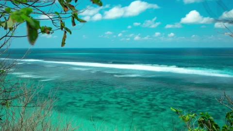 View on ocean from cliff. Clear blue water, and many big waves. Time lapse. Stock Footage 115281420