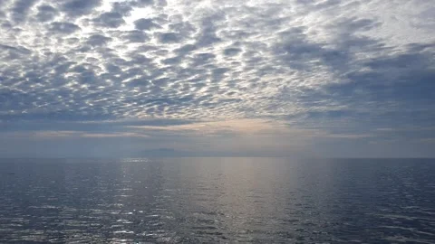 View of ocean currents and waves with a background of sky and clouds Stock Footage 297024686