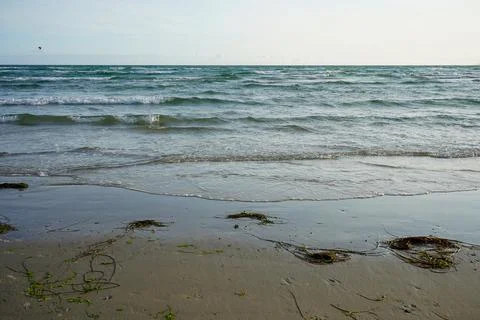 View of the ocean lapping on a sandy shore Stock Photos