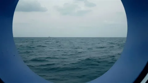 View of the ocean from the porthole of the ship going. Stock Footage 108585177