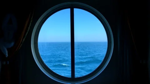 View of ocean seen through a porthole of a ship Stock Footage 94425447