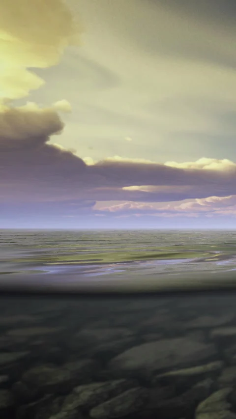 View of ocean under clouds during sunset with waves rolling on shore Stock Footage 334259181