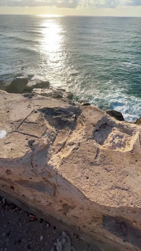 View of the ocean from under a rock Stock Footage 304362029