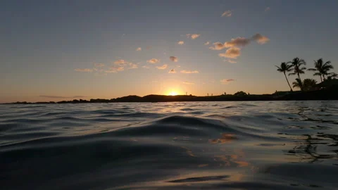 View from Ocean Water Level Towards Distant Hawaiian Coastline Stock Footage 270403980