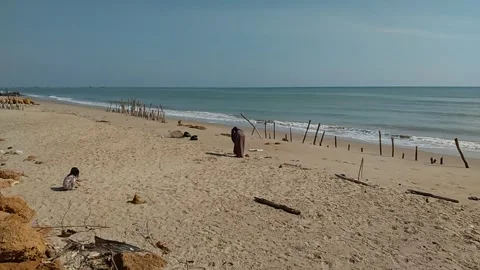 View of ocean waves and beach sand seen from the beach Stock Footage 254939567