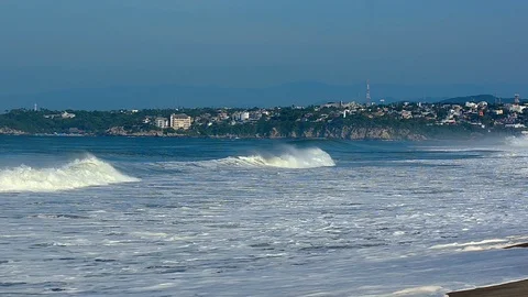 View to the ocean waves and Puerto Escondido town at the background Stock Footage 95654721