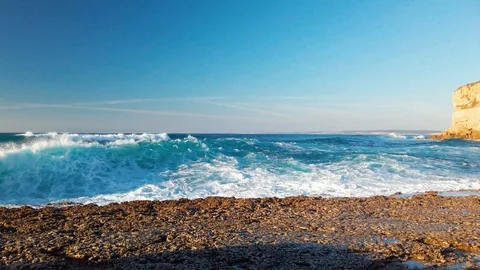 View of the Ocean Waves from Rocky Beach, sunny day Video stock 123019711