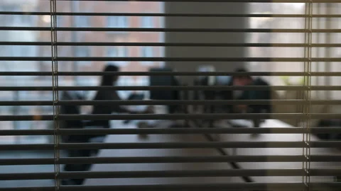 View of the office office through the partially opened blinds 스톡 동영상 171573100