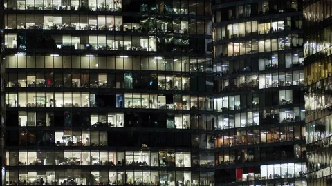 View of office windows with working people. Timelapse Stock Footage 125626374
