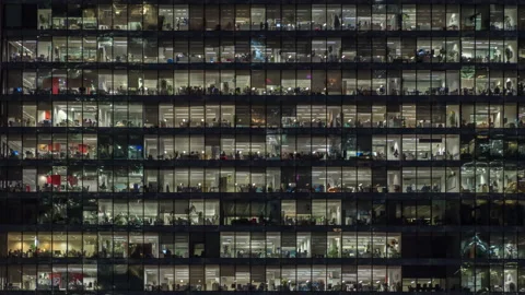 View of office windows with working people Stock Footage 142087962