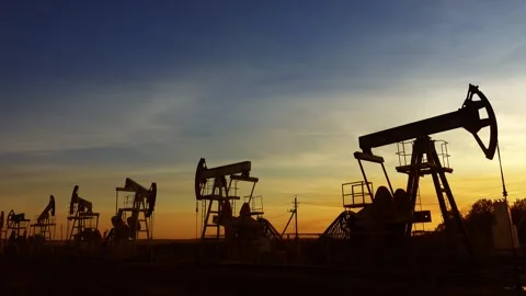 View of oil pump jacks at sunset in Russia. Stock-Footage 344394730