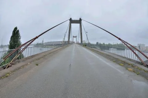 View of old abandoned cable-stayed Rybalskii bridge, Kyiv,Podol, Ukraine Stock Photos