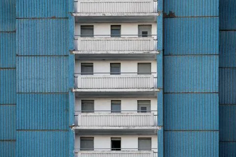 View of the old blue panel house with balconies Stock Photos