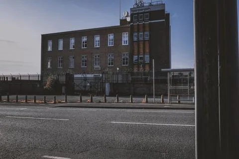 A view of an old brick building, showcasing its historic architecture and wea Stock Photos