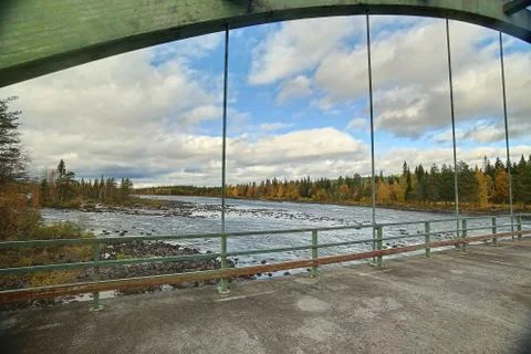 View from old bridge crossing Pite river at Ljusselforsen in Lapland Stock Photos