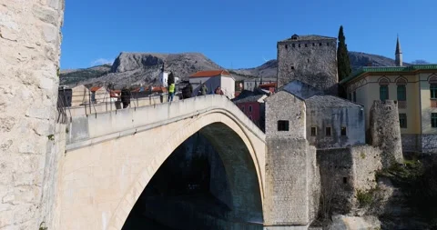 View of the Old Bridge in Mostar city in Bosnia Herzegovina during sunny day Stock Footage 231796142