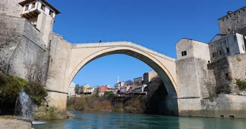 View of the Old Bridge in Mostar city in Bosnia Herzegovina during sunny day Stock Footage 231796292