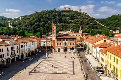 View of the old building, chess square and castle on the mountain. Stock Photos