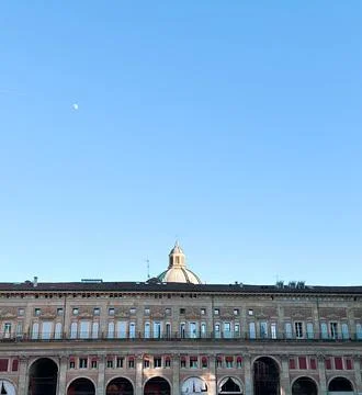 View of old building facade with arched windows in Bologna, Italy.   Stock Photos