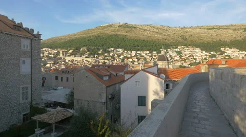 View of old buildings and mountain seen from the City Wall in Dubrovnik Stock Footage 60389221