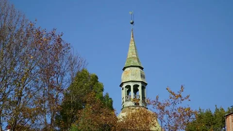 View of an Old Church Tower Surrounded by Autumn Tree Tops. Stock Footage 306401597