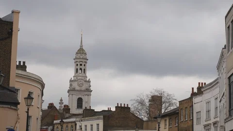 A view of an old clock tower and buildings in London. Stock Footage 105014515