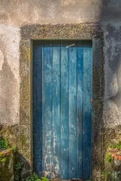 View of an old closed door in rustic wood painted blue Stock Photos