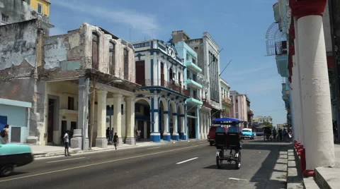View to old destroyed houses of cental street in Havana city at summer sunny Stock Footage 67865675