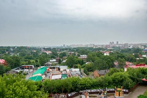 View from old fire tower shows museum exhibit and blue church top far away Stock Photos
