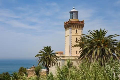 View of the old lighthouse on the Atlantic Ocean coast on the Cape Spartel .. Stock Photos