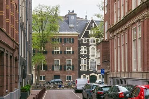 View of the old red bricks historical buildings in the center of Amsterdam. Stock Photos