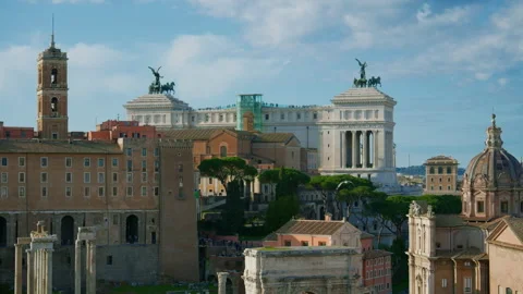 View of old Rome on a sunny day, with the Altar de la Patria and the Roman Forum Stock Footage 308412756