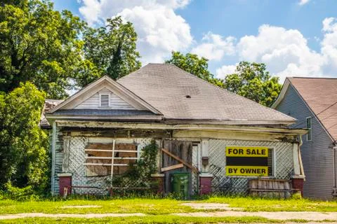View of an old run down home boarded up Stock Photos