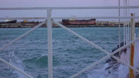 View of old ships at the shipyard through the fence Stock Footage 130893068