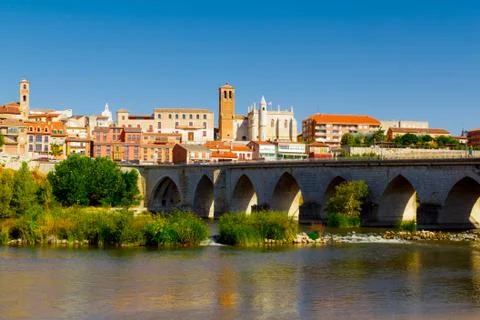 View old stone bridge of  Douro river and old town Tordesillas. Spain Stock Photos