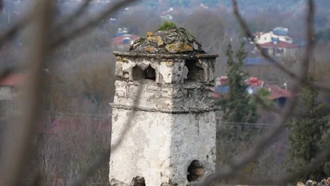 View Of An Old Stone House Chimney Through A Tree Branch Stock Footage 195990942