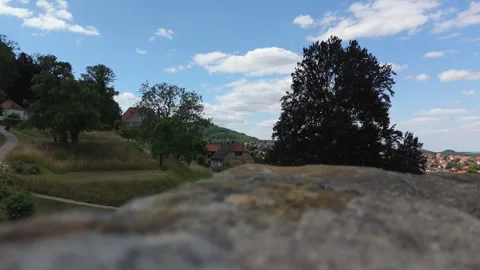View from the old stone tower over a tree and Blankenburg rooftops Vídeo Stock 337979129