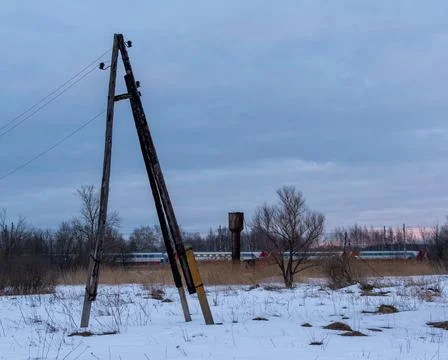 View of an old structure for electric cables in the middle of a rural or suburba Foto stock