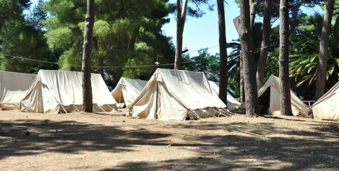 View of an old tent camp in the woods Stock Photos