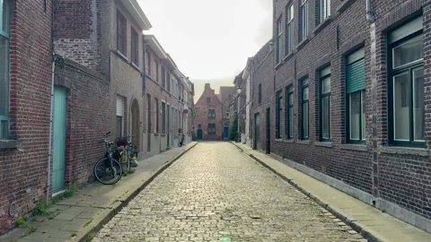 View of the old town of Bruges in Belgium. Small old paved city street Stock Footage 334846647