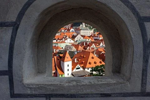 View of the old town through the observation window of the fortress. Czech Kr Stock Photos