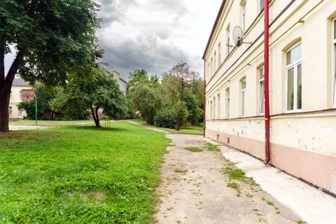 View of an old typical courtyard of the Soviet era. Russian poverty and ruin. Stock Photos