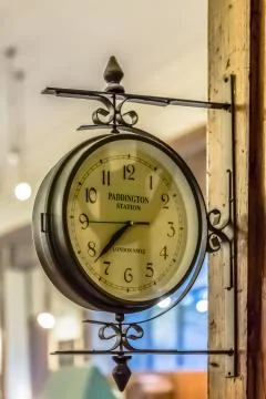 View of a old vintage clock wall, classic british style and ornamented Stock Photos