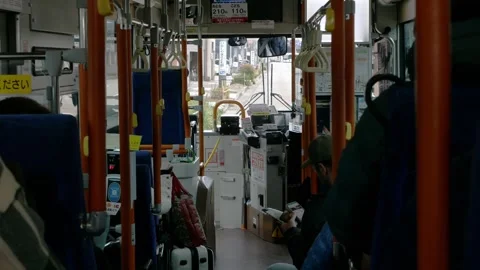 View onboard inside city kanazawa bus while operating driving on street in .. Stock Footage 339574418